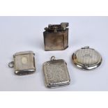 An Art Deco hallmarked silver cased lighter with starburst engraved decoration and inscribed