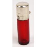 A Victorian hallmarked silver mounted cranberry glass scent bottle with hinged cap,