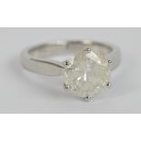 A platinum and diamond solitaire ring, the claw set stone weighing approx 3.