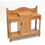 An early 20th century oak hall stand with single cupboard door, width 92cm.