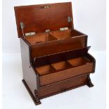 A novelty Edwardian mahogany cigarette box modelled as a piano with two hinged compartments above a