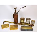 A small group of metalware comprising three cigarette boxes, three brass carriage clocks,