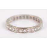 A white metal diamond set full eternity ring, size P, approx 2.9g.