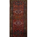 An antique Persian Heriz runner, 324 x 97cm.