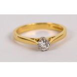 An 18ct yellow gold diamond solitaire ring from Beaverbrooks, the claw set stone weighing approx 0.