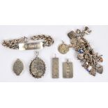 A collection of silver jewellery including a charm bracelet, oval locket engraved with leaves,