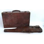 A vintage leather leg-o-mutton gun case with initials "C.H.W.