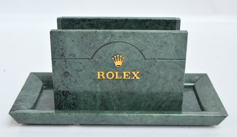 A green marble Rolex letter/stationery rack with gilt applied letters to both sides and with a