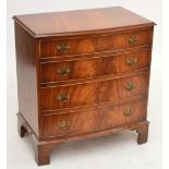 A reproduction mahogany bowfronted chest of four long drawers, on bracket feet, width 78cm,