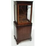 A reproduction mahogany display cabinet,