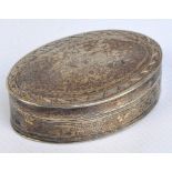 A George III hallmarked silver oval snuff box with decorative pin pricket band to the detachable