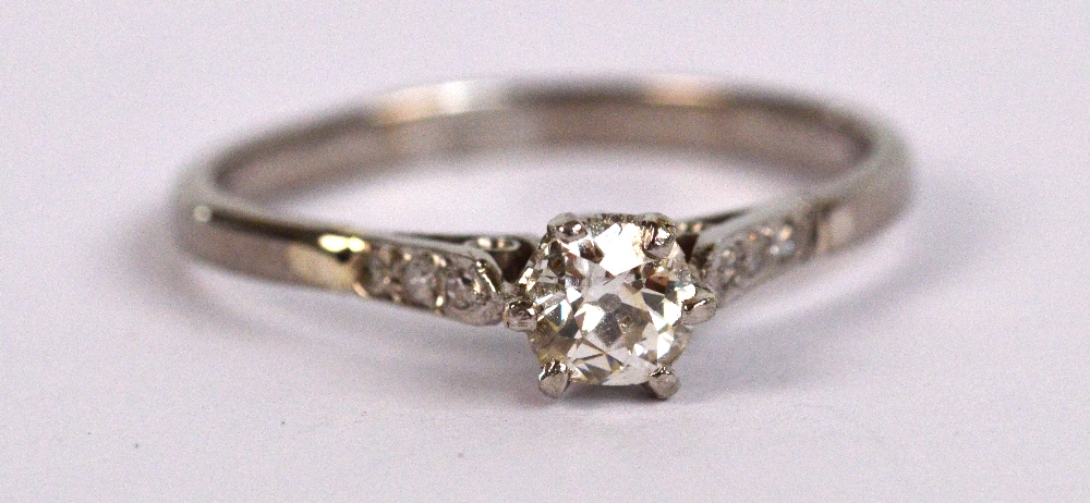 A white metal diamond solitaire ring, the principal stone weighing approx 0.