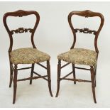 A pair of simulated rosewood bedroom chairs.