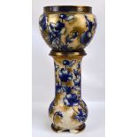 A Royal Doulton Blue Iris pattern decorated jardinière on cylindrical stand with bulbous base,