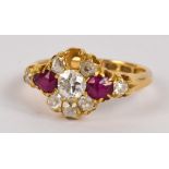 An 18ct yellow gold diamond and ruby ring, the central diamond weighing approx 0.