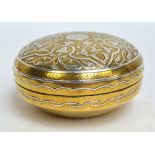 An early 20th century Cairo Ware brass circular box and cover,