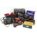 A collection of various vintage leather cased camera comprising Practika, Zenit, Petri and Kodak,