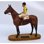 A Beswick figure of "Arkle with Pat Taaffe", on wooden base with inscription plaque (af).