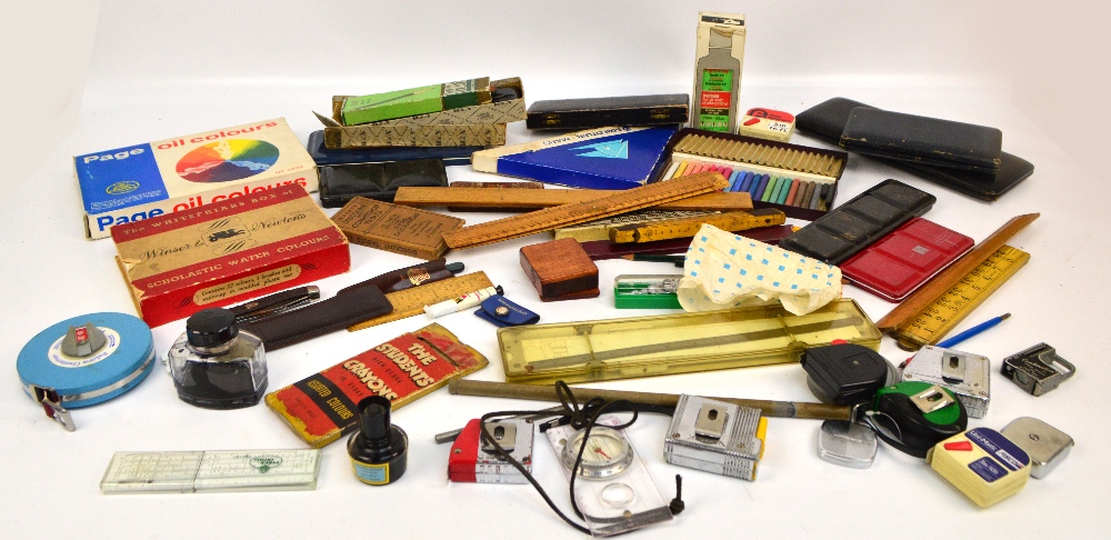 A group of various drawing instruments to include wooden rulers, pen nibs, pencils,