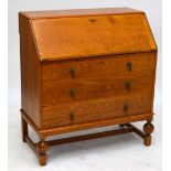 An early 20th century light oak bureau,