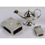 A George V hallmarked silver novelty table lighter in the form of an Aladdin's lamp, loaded,