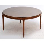 A Silkeborg Danish teak circular coffee table raised on four tapering supports bearing sticker to
