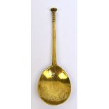 A 17th century English brass seal top spoon with traces of marks to the fig shaped bowl,