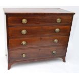An early 19th century mahogany crossbanded and boxwood strung chest of four long graduated drawers