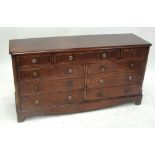 A reproduction mahogany nine-drawer sideboard raised on bracket feet, width 146cm.