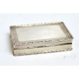 A large Elizabeth II hallmarked silver snuff box of rectangular form with engraved engine turned