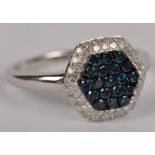 A 9ct white gold diamond and fancy blue diamond ring with hexagonal platform, size P.