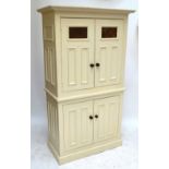 A painted pine two section food cupboard, with two pairs of doors, width 107cm.