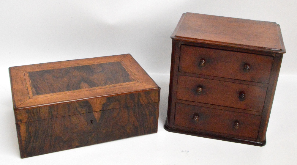 A small mahogany three drawer cabinet with knob handles, width 28cm, height 27cm,