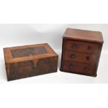 A small mahogany three drawer cabinet with knob handles, width 28cm, height 27cm,