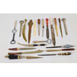 A group of eighteen various paper knives/letter openers and three bottle openers including