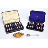 An Elizabeth II hallmarked silver gilt twin handled tea strainer and dish,