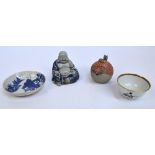 An early 19th century Chinese tea bowl with probable English decoration, a blue and white saucer,