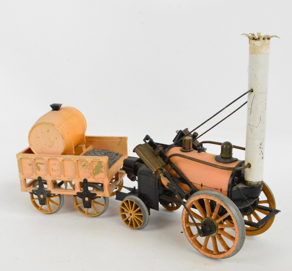A Hornby model of Stephenson's Rocket pulling a barrel and coal tender, length 41cm (af).