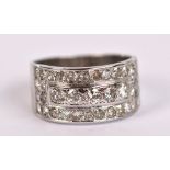 An 18ct white gold diamond set broad half eternity ring,