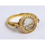 CHOPARD; an 18ct yellow gold "Happy Diamond" ring, size K, approx 5g.