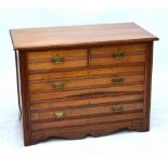 An Edwardian walnut chest of two short and two long drawers, top 104 x 53.5cm, height 76cm.