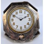 A George V hallmarked silver Art Deco style crown wind travelling eight day clock of octagonal form