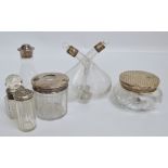 A group of variously hallmarked silver mounted clear glass items to include a vinegar/oil condiment