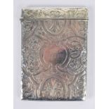 A Victorian hallmarked silver card case of rectangular form with overall engraved foliate and