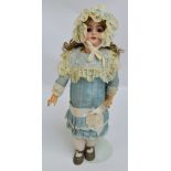 An early 20th century Simon Halbig bisque headed doll with open/close eyes and open mouth revealing