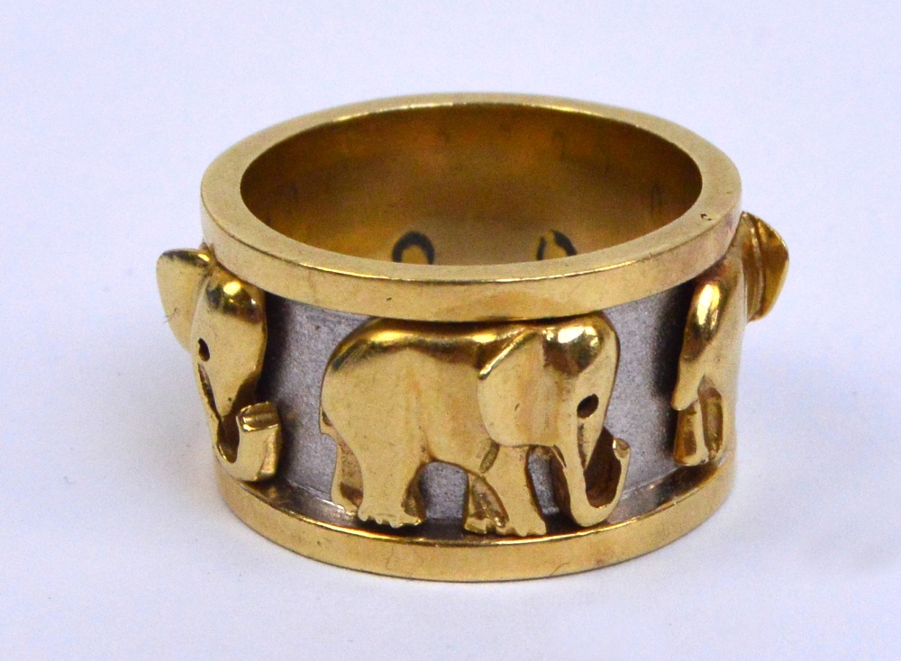 In the manner of CARTIER; an 18ct two tone gold ring,