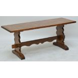 An oak coffee table of rectangular form with stretchered supports, 107 x 40.5cm, height 44cm.