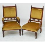 A pair of Victorian walnut and upholstered lady's and gentleman's chairs with spindle decoration,