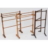 A pair of towel rails and a folding towel airer (3).