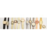 A small collection of fashion watches including examples by Swatch with a coloured paste strap.